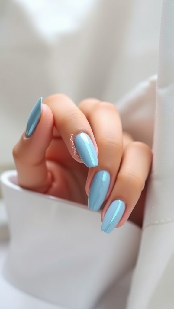 Nails featuring a matte base and light blue chrome tips.