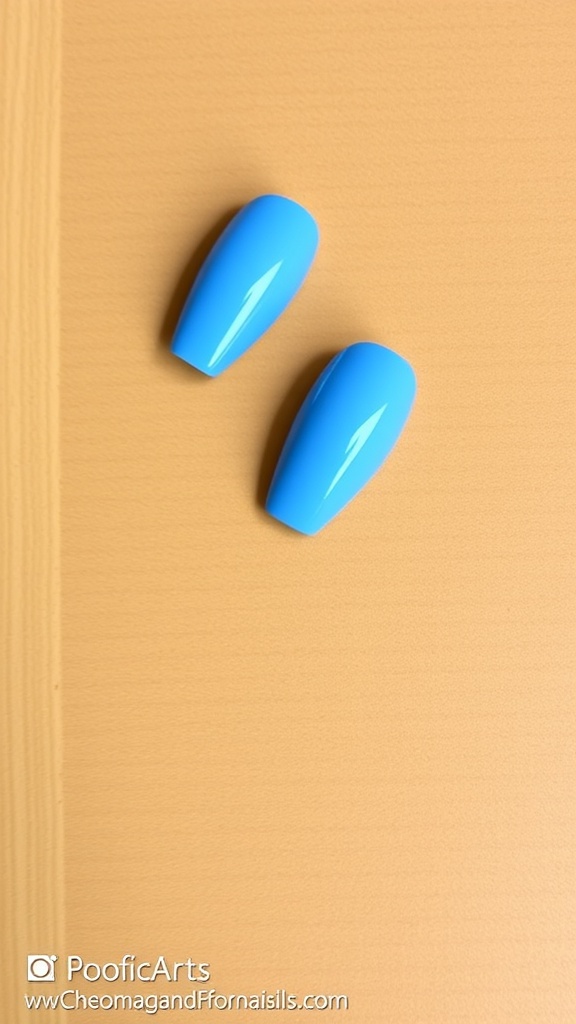 Two baby blue acrylic nails on a textured beige background
