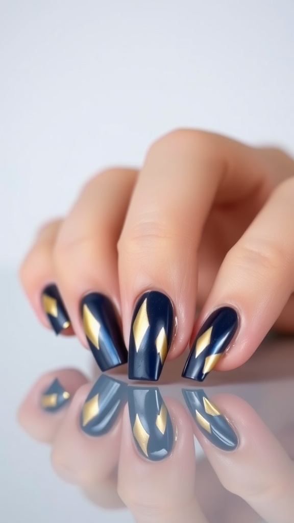 Close-up of hands with metallic French nail art featuring navy and gold designs.