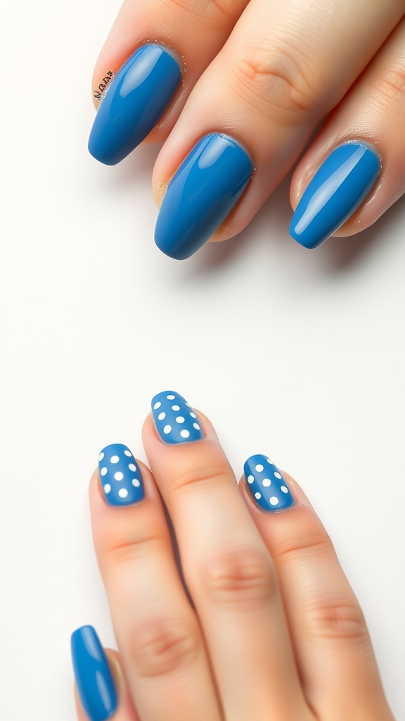 A close-up of a manicure featuring bright blue nails with white polka dots on some nails, showcasing a minimalist nail design.