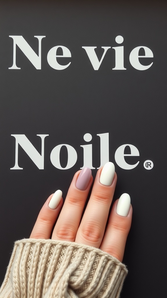 A hand with negative space French nails featuring soft colors on a dark background.