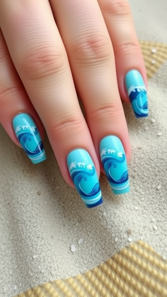Close-up of short coffin nails with ocean wave designs in blue and white colors.