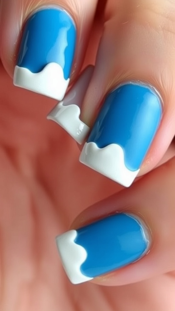 Nail art featuring blue base with white wave tips