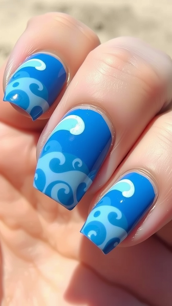 Close-up of blue nails with white ocean wave designs