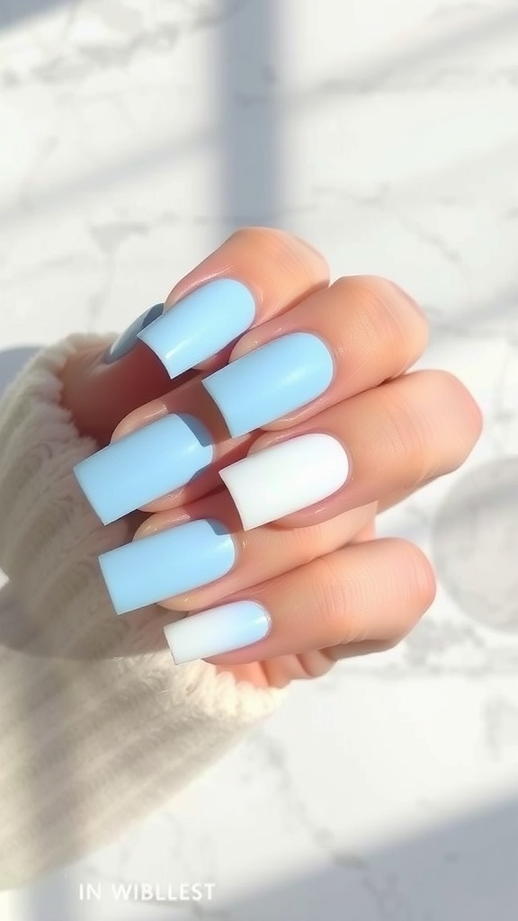 Light blue square nails featuring an ombre effect from blue to white