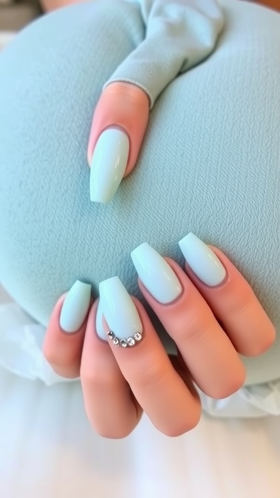 Pastel light blue nails with rhinestones
