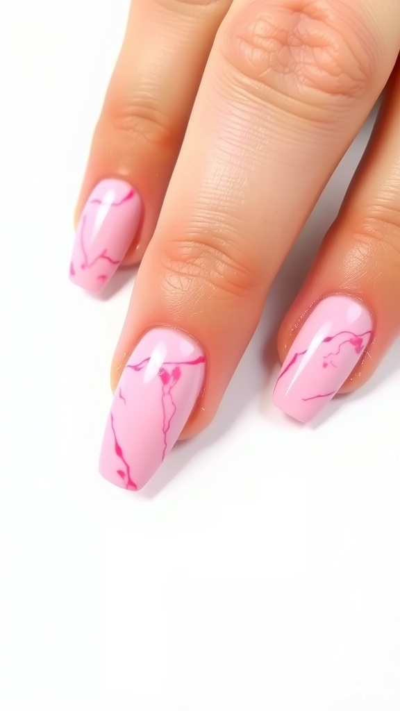 Close-up of pink marble almond nails with marbled designs in darker pink tones.
