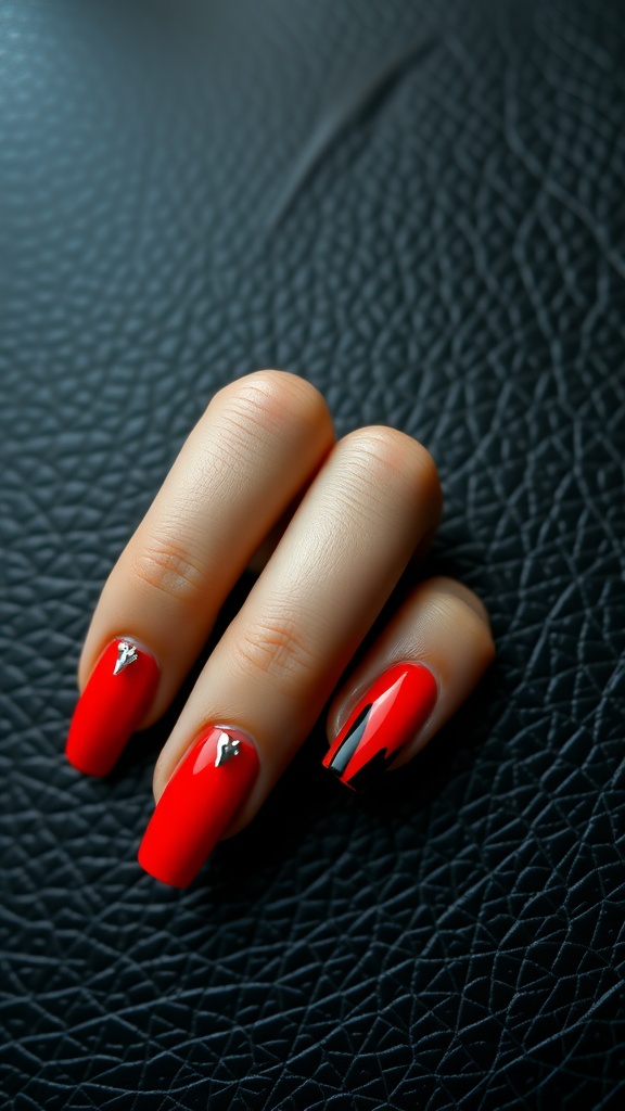 Stylish red and black contrast nails with silver accents