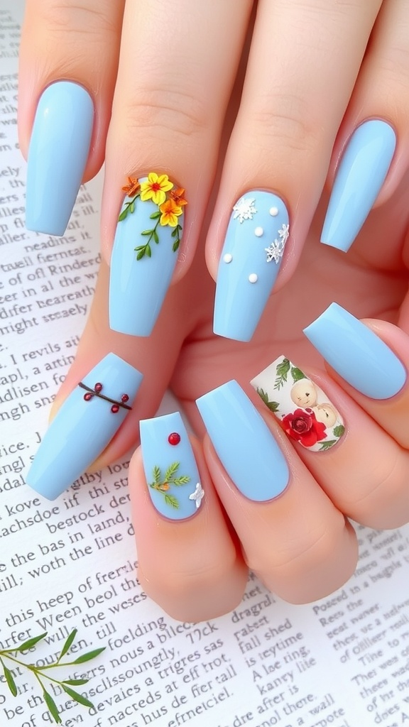 A set of acrylic nails painted in baby blue with seasonal decorations like flowers, snowflakes, and berries.