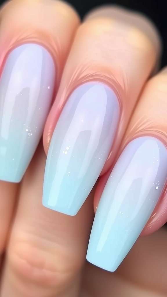 Soft pastel blue ombre acrylic nails transitioning from lavender to sky blue