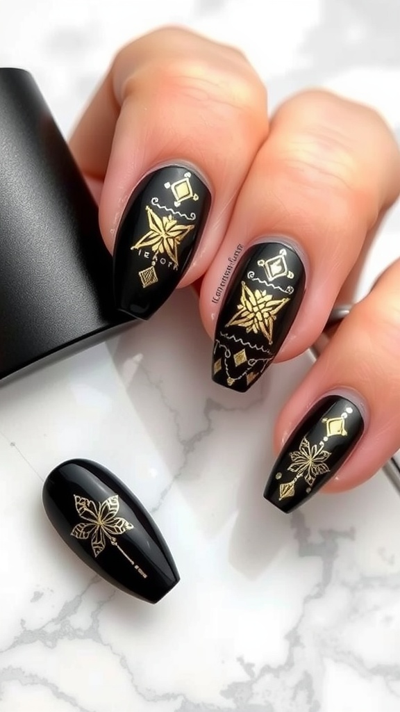 Black almond nails with gold accents and intricate designs