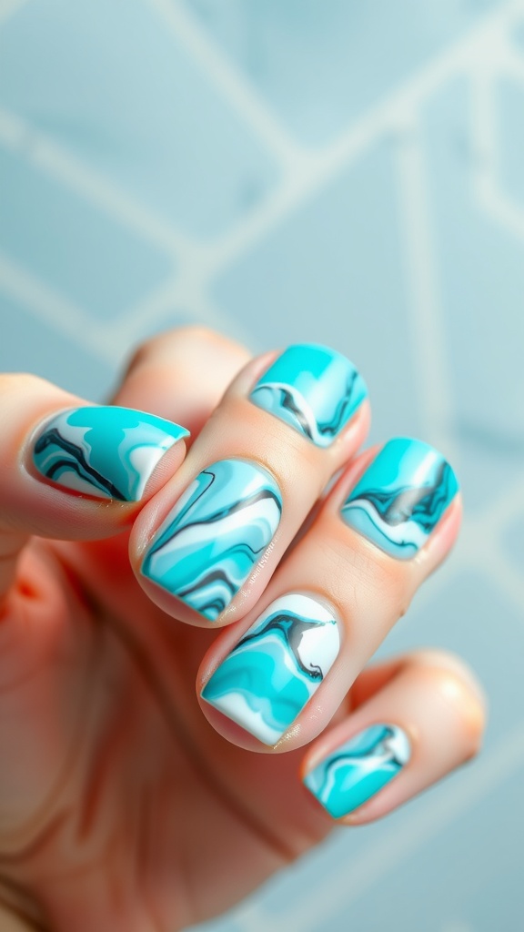 Close-up of turquoise marble effect nails with shades of blue and white