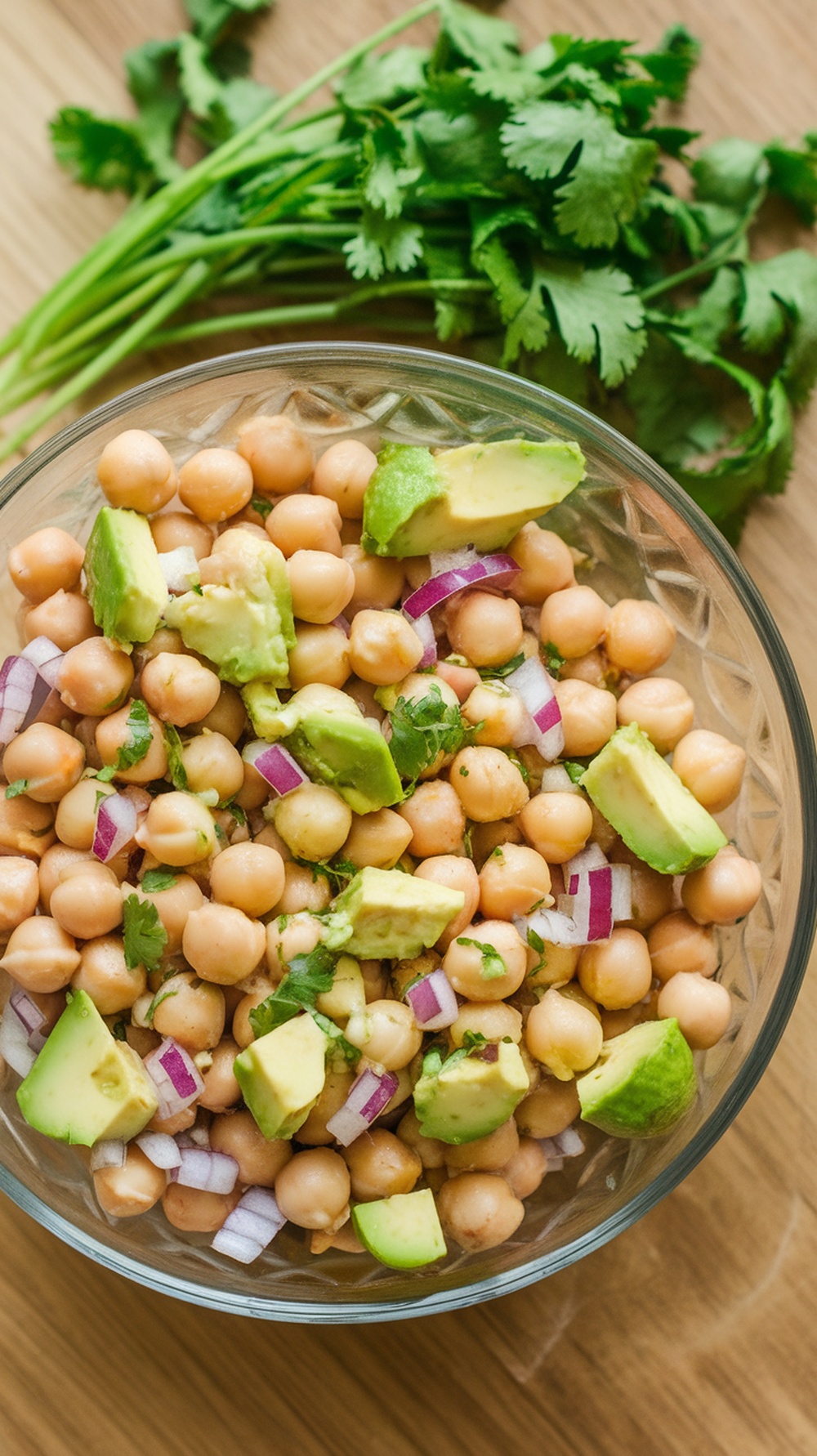 Chickpea salad with avocado, lime, and cilantro in a bowl