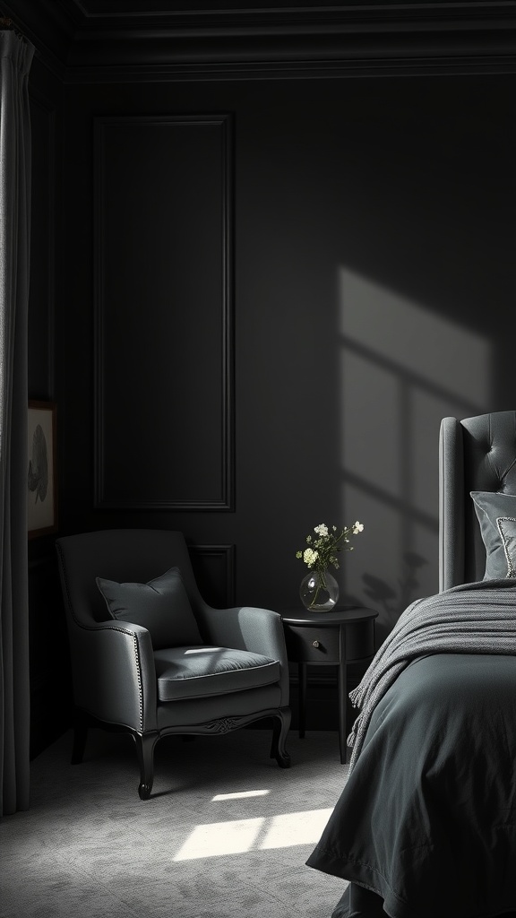 A stylish black accent chair in a dark bedroom with a small side table and a vase of flowers.