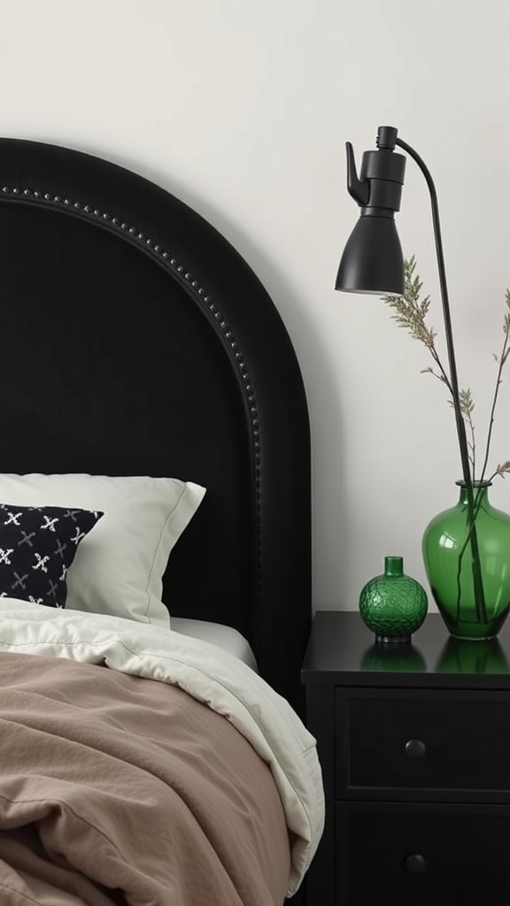 A stylish black and green bedroom featuring a black bedside table, a green glass vase, and a modern lamp.