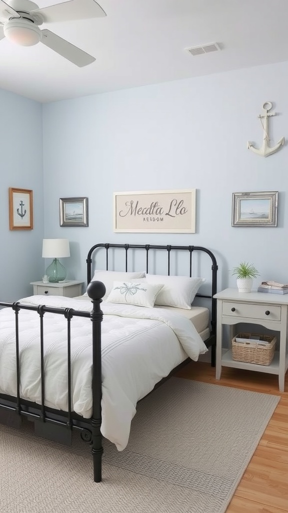 A coastal-inspired bedroom featuring a black metal bed frame, light blue walls, and nautical decor.
