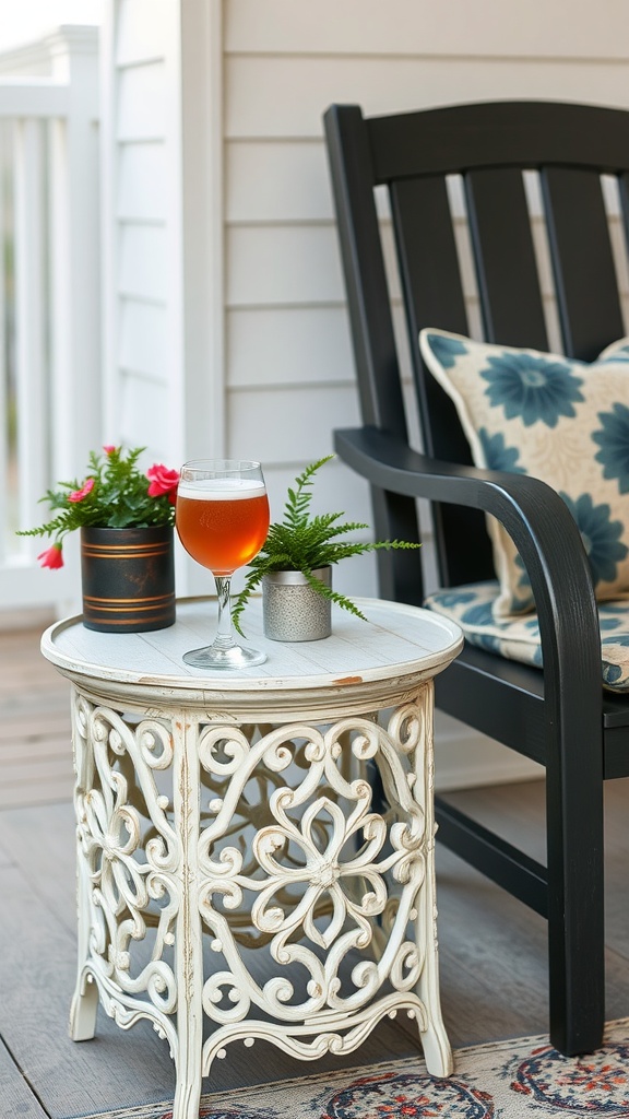 A decorative side table with a drink and plants on a small front porch