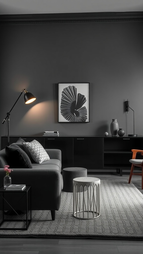 A stylish black living room featuring layered lighting with a floor lamp, wall art, and dark furniture