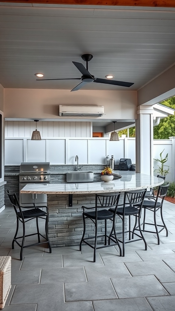Outdoor kitchen with bar area featuring a grill, stone countertop, and bar stools