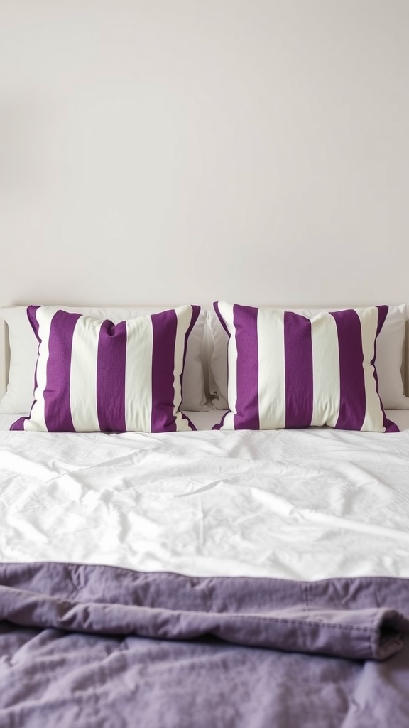 Purple and white striped accent pillows on a bed