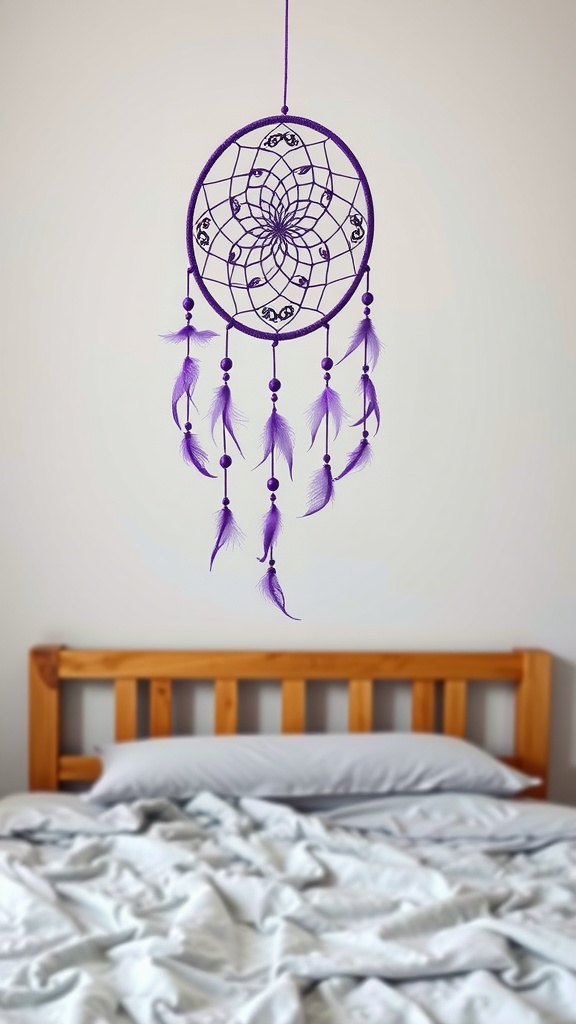 A purple dreamcatcher hanging above a bed with gray bedding.