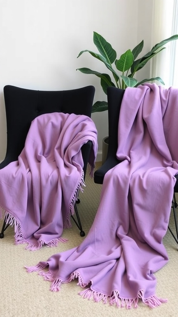 Two black chairs with purple throw blankets draped over them, accompanied by a green plant in the background.