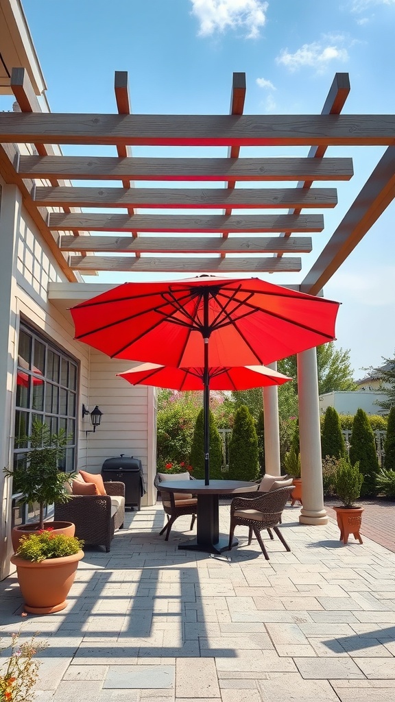 A front patio featuring a red umbrella and a wooden pergola, with a dining table and chairs