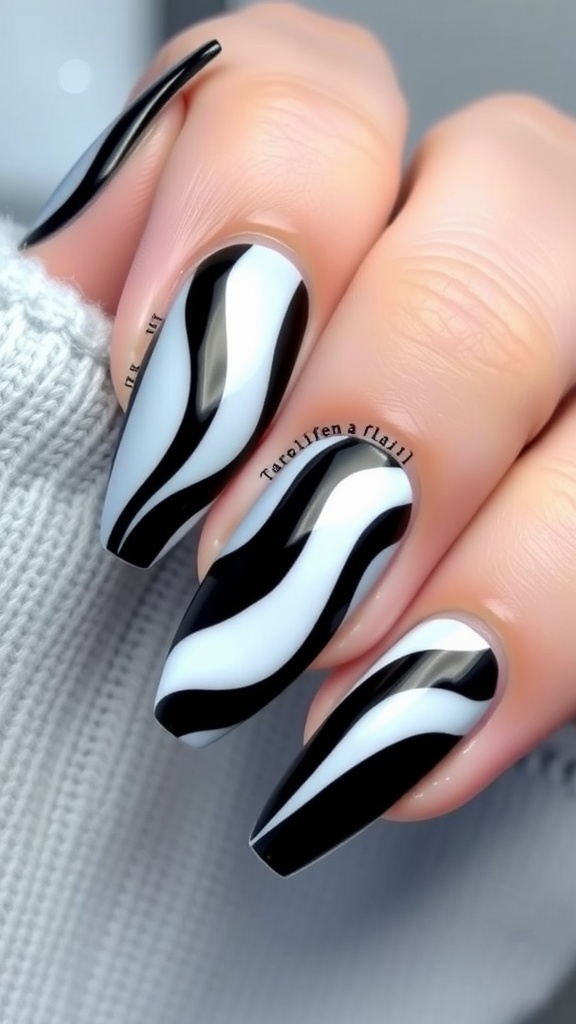 A hand showing black to white ombre nails, with black polish on the tips and white polish at the base.
