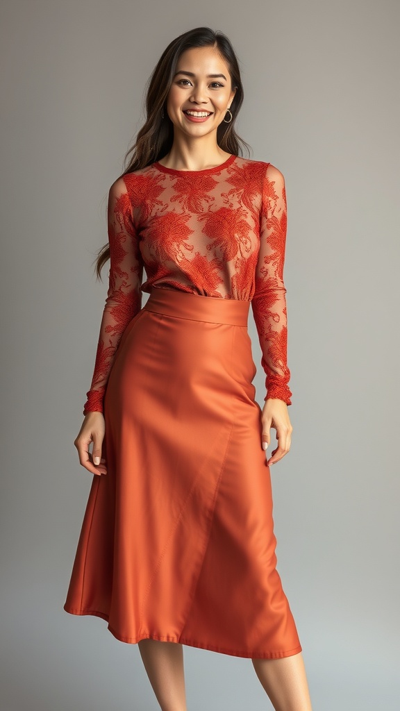 A woman wearing a copper lace long sleeve top and a high-waist skirt, smiling confidently.