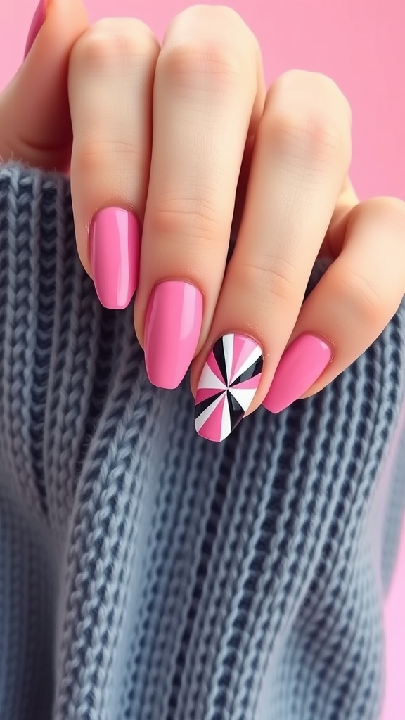 A close-up of a hand with pink nails, featuring a geometric design on one nail.