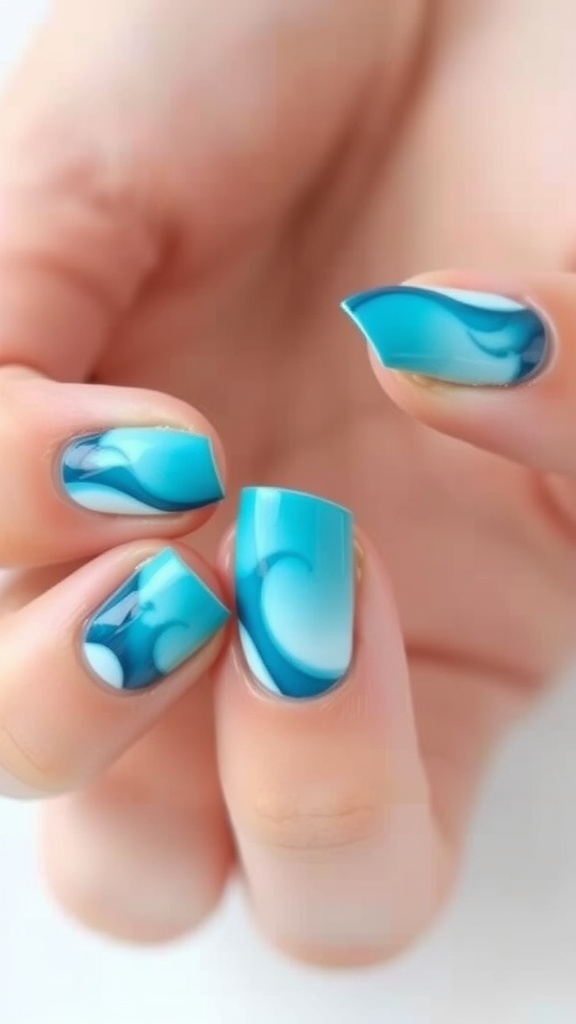 Nails featuring Ocean Wave Ombre design with shades of blue and white