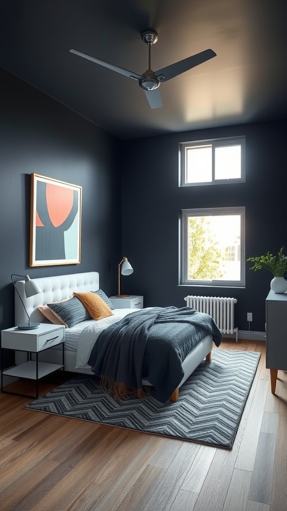 A small masculine bedroom featuring deep navy walls, a white bed with dark bedding, and warm accent pillows.