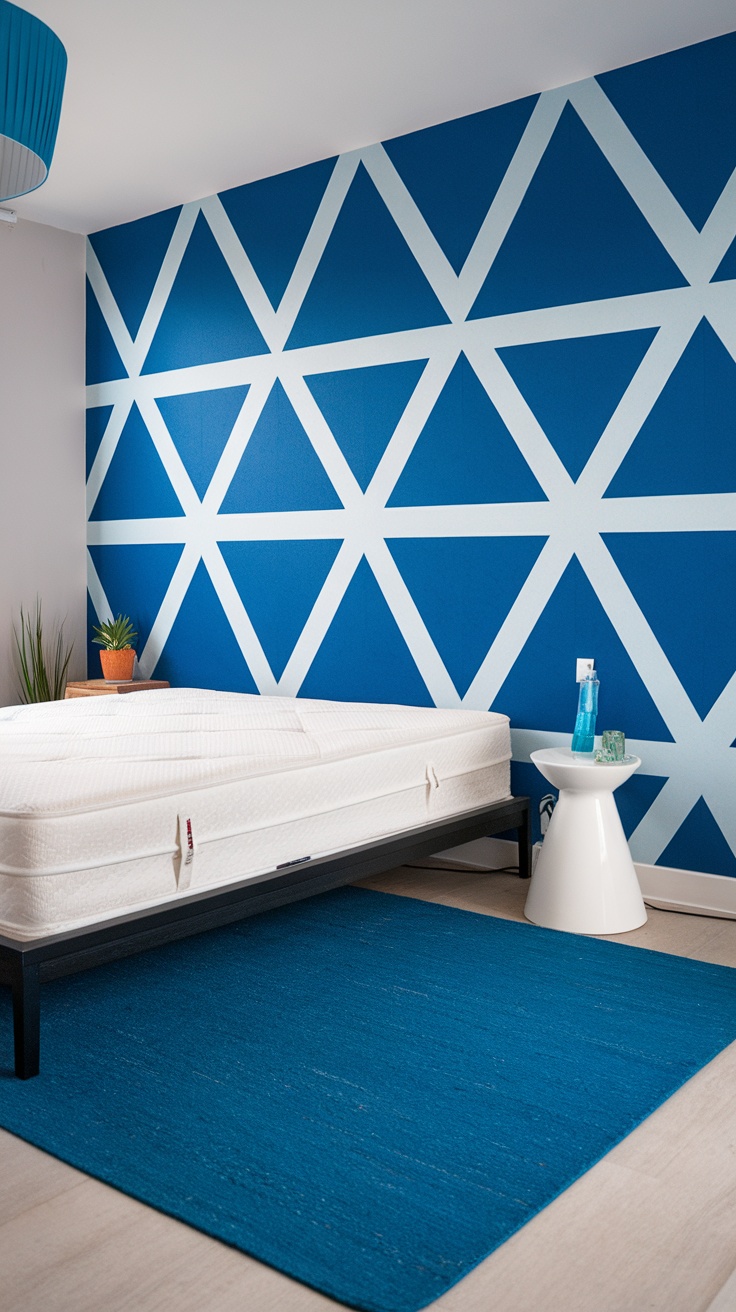 A bedroom featuring a blue wall with white geometric triangles, a simple bed, and modern decor.