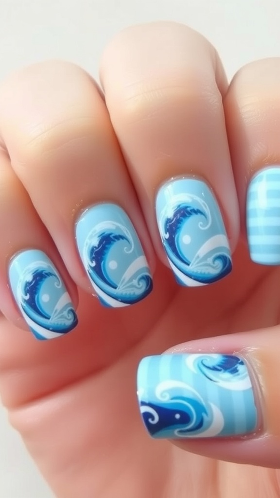 Nails featuring ocean wave designs in blue and white colors.