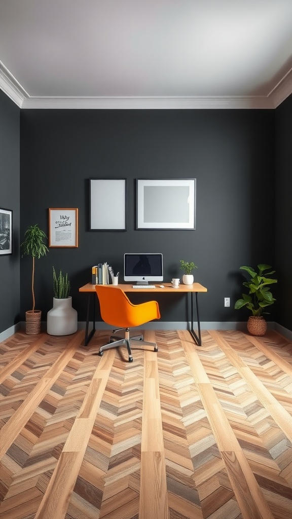 An office space with charcoal walls, wooden herringbone flooring, an orange chair, and plants.