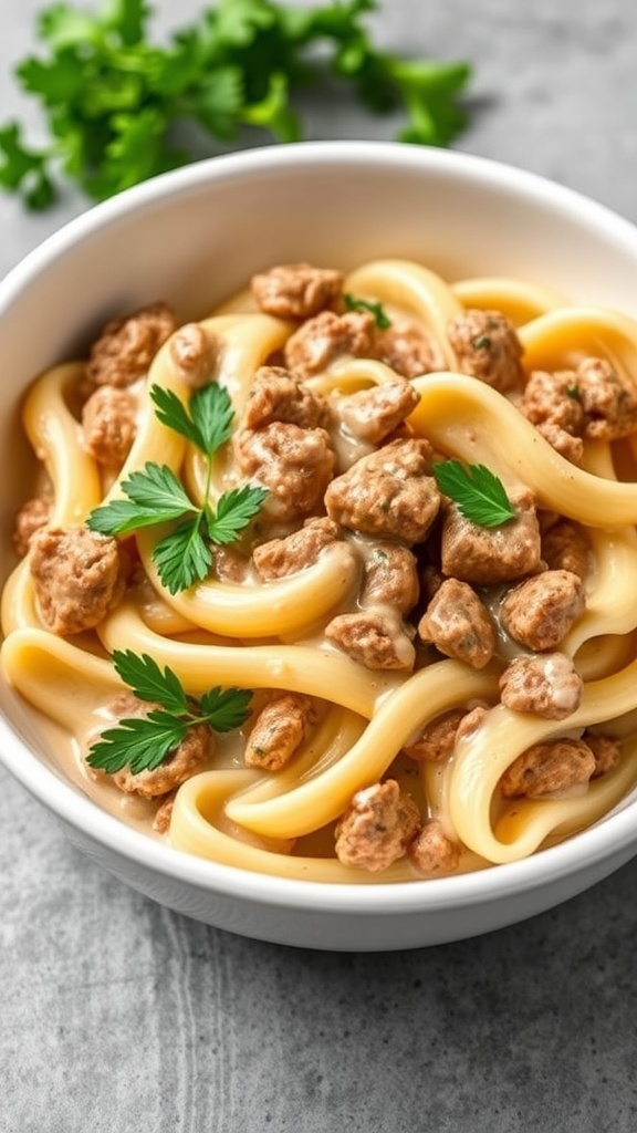 A bowl of creamy garlic Mongolian beef pasta with parsley garnishing.