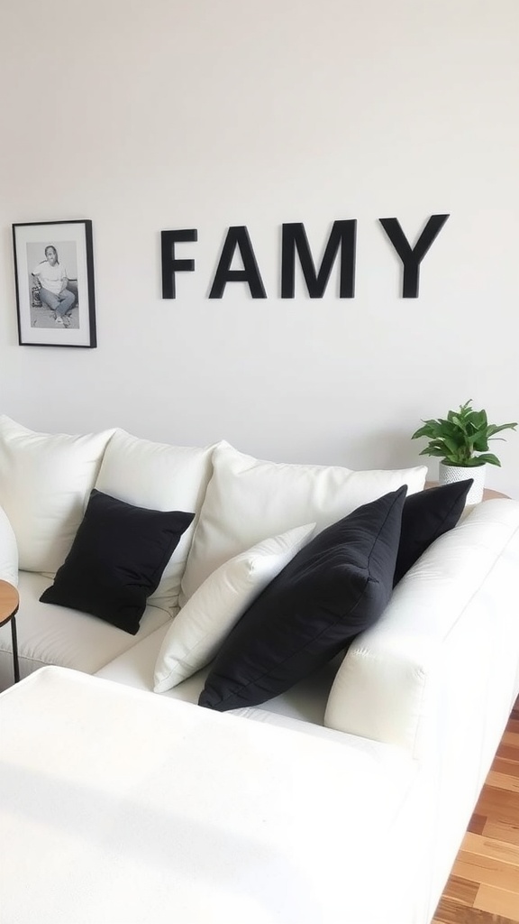 White sofa with black throw pillows in a cozy living room setting.
