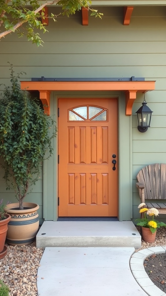 Front door painted in terracotta color, surrounded by plants and decorations, against a sage green house.