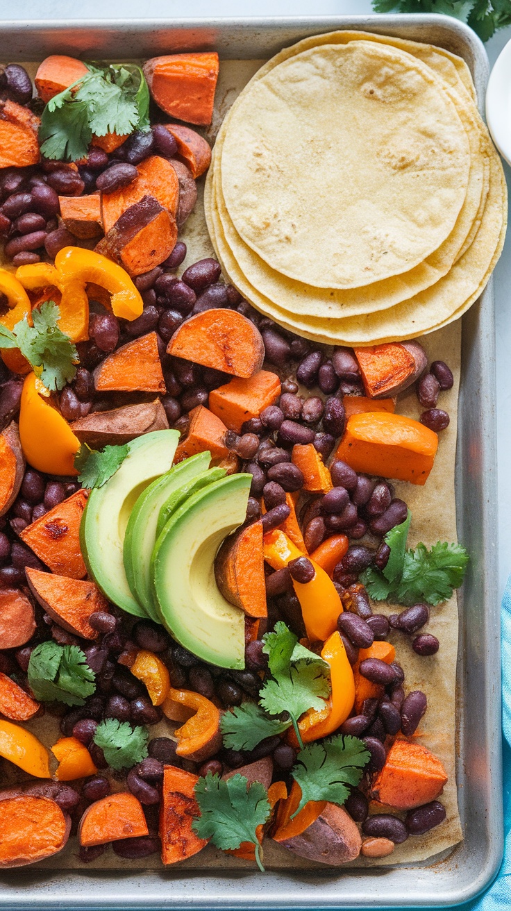 A sheet pan of roasted veggies with tortillas and avocado