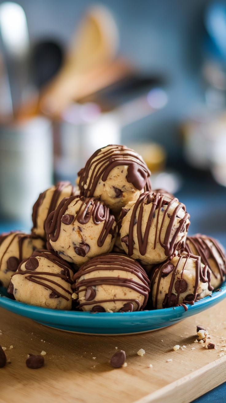 A plate of chocolate chip cookie dough bites drizzled with chocolate.